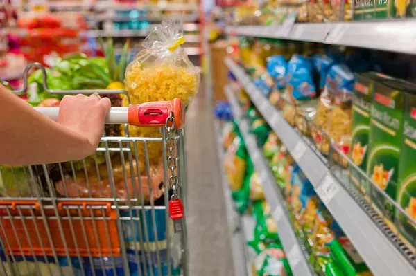 depositphotos_11809299-stock-photo-woman-with-shopping-cart-in